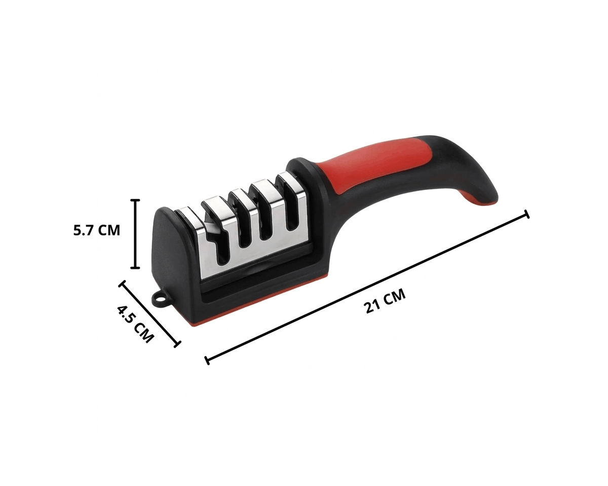 Compacte messenslijper met rood-zwart handvat op een licht marmeren oppervlak.